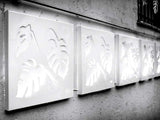 white applique monstera laser cut wall sculpture backlit 